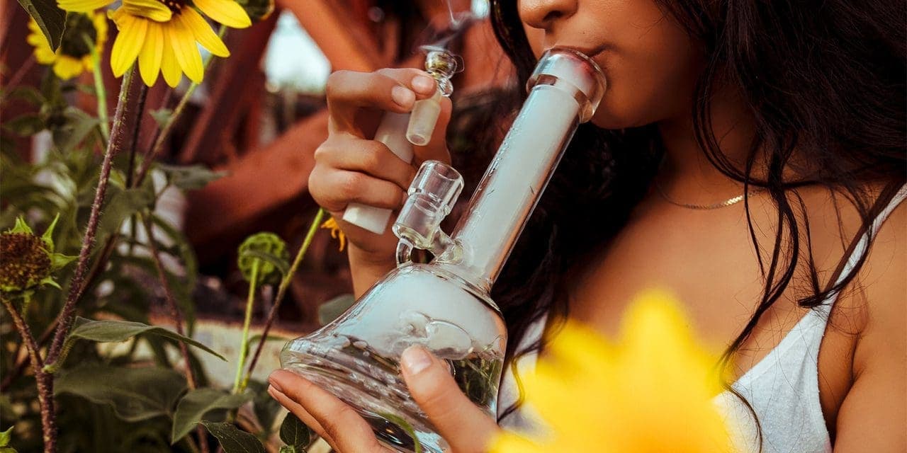 woman smoking with a bong